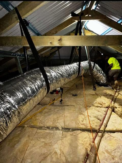 Insulated ducting hung on straps through a Perth roof space
